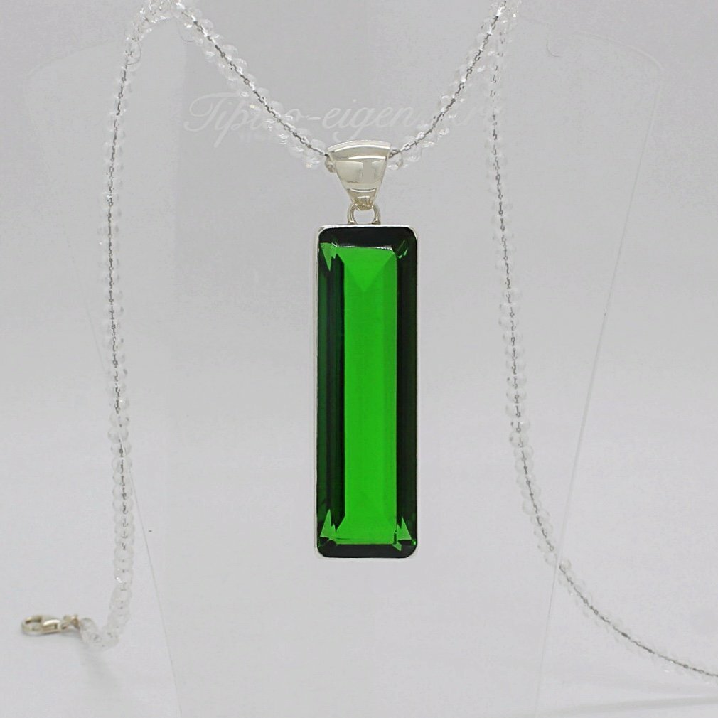Silver pendant with emerald-green rectangular obsidian, 1.5 x 5 cm, on a delicate silver chain.