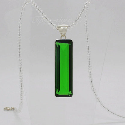 Silver pendant with emerald-green rectangular obsidian, 1.5 x 5 cm, on a delicate silver chain.