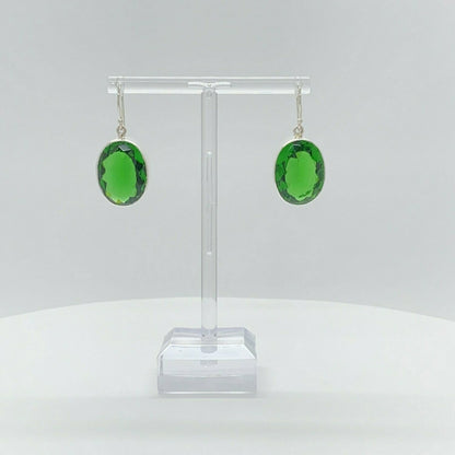 Oval emerald-green obsidian earrings, 1.5 x 2 cm, set in 925 sterling silver, handmade in Germany.