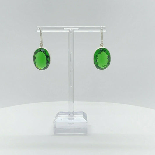 Oval emerald-green obsidian earrings, 1.5 x 2 cm, set in 925 sterling silver, handmade in Germany.