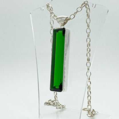 Silver pendant featuring emerald-green obsidian rectangle (1.5 × 7 cm) on a silver chain.