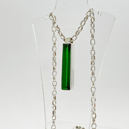Silver rectangular pendant with emerald-green obsidian, 1x5 cm, on a chain.